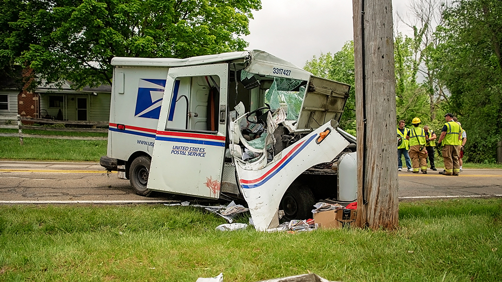 USPS Carrier Ejected After Mail Truck Hits Pole